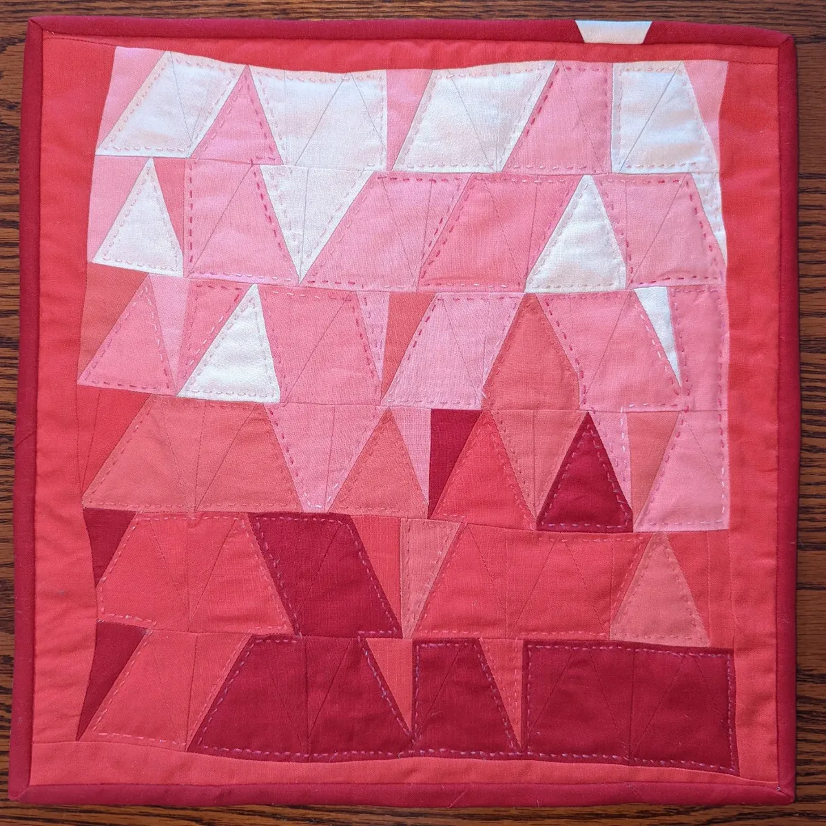 Mini Quilt — pink and red triangle patchwork